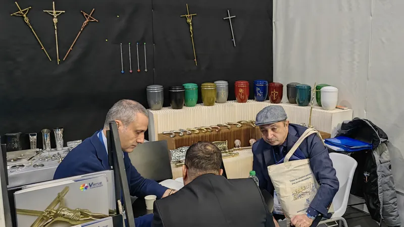 Virtue Hardware Co., Ltd stand at a funeral trade fair in France showing coffin handles and crucifix samples