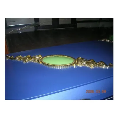 Casket decoration 6220 in plastic material and gold color side view