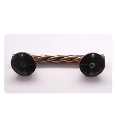 Fixed point coffin handle 1009 antique copper finish with twisted steel bar side view