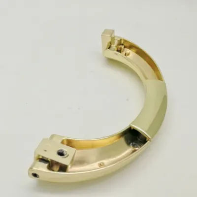 Slim half moon coffin handle 1042 in high polished and gold plated detail view